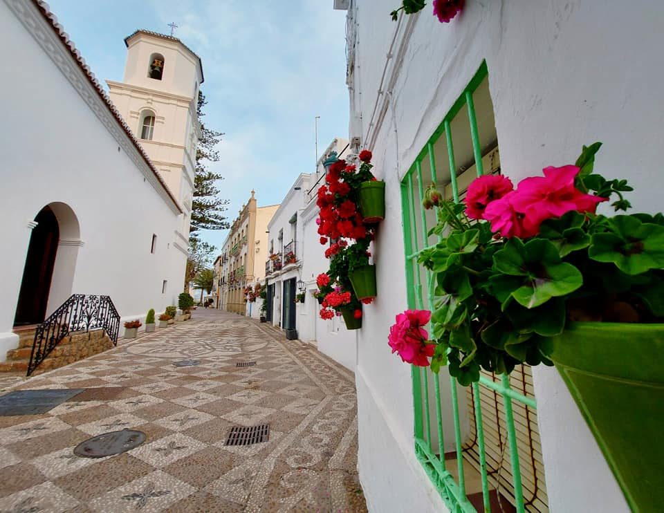 Old town street in Nerja with flowers